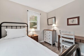 Enjoy a mix of comfort and practicality in this thoughtfully appointed bedroom with all the essentials.
