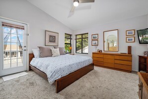 The Primary Suite has a King bed, Office Nook, En-Suite bathroom and walk in closet, plus direct access to the balcony.