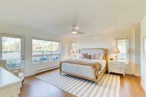 Primary bedroom features a king bed, balcony, and ensuite bathroom.