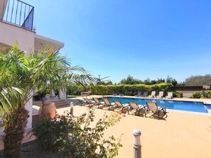 swimming pool area between the two villas in the orchard gardens.