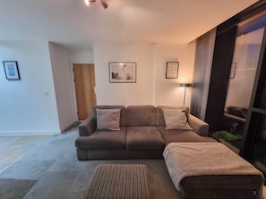 Enjoy the spacious living room, ideal for relaxing with a book, socializing, or simply taking in the view