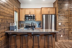 Fully Equipped Kitchen with Additional Bar Seating