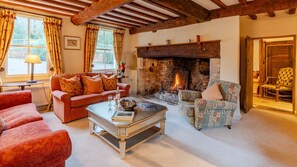Linger over fireside conversations in the drawing room