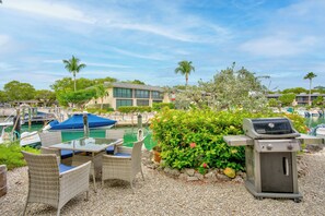 Grill and outdoor table just outside unit