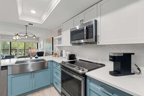 There is a modern kitchen that is well appointed inside of the condo 