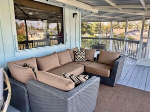 Sit back in comfort and relax on this wrap around porch.