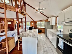 Updated fully equipped kitchen with new large sitting island.