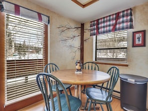View of the dining area with seating for four, ideal for enjoying meals or gathering together