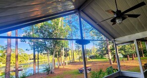 Looking through the porch to backyard and lake beyond