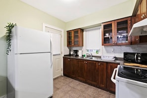 Fully equipped kitchen with all the tools you need for a perfect culinary experience. Enjoy the convenience of having everything at your fingertips!