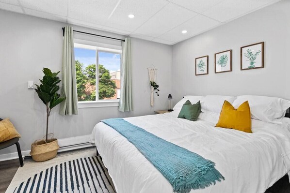 The bedroom offers a luxurious retreat, with a bed that promises restful nights and a room that feels like a private oasis.