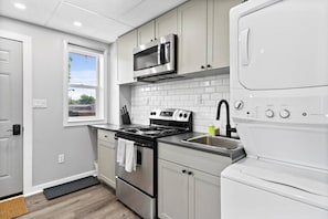 The kitchen invites you to experiment with new recipes, offering a stylish and practical space to cook and create.