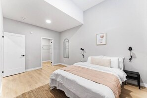 The bedroom offers a luxurious retreat, with a bed that promises restful nights and a room that feels like a private oasis.