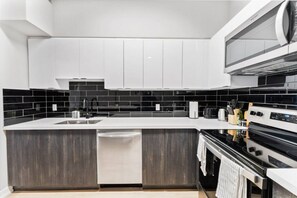 As you step into the kitchen, the clean lines and functional design make you eager to start cooking your favorite dishes.