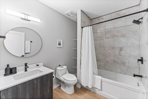 You feel a sense of calm as you enter the bathroom, where the thoughtful design and high-quality materials create a serene environment.