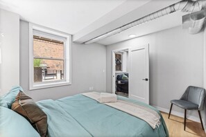 comfortable pillows, throw blanket and blinds in the building