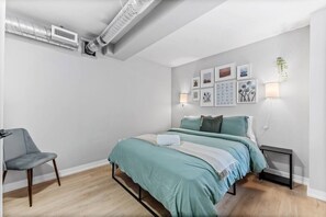 The bedroom’s serene ambiance invites you to relax, with a plush bed that promises a restful night's sleep.