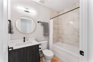 You feel a sense of calm as you enter the bathroom, where the thoughtful design and high-quality materials create a serene environment.