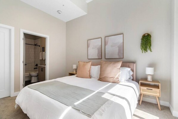 The bedroom’s serene ambiance invites you to relax, with a plush bed that promises a restful night's sleep.
