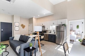 An open-concept area featuring a modern furnishings, and a stylish entertainment setup—ideal for gatherings and relaxation.