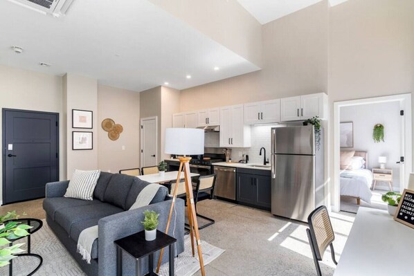 An open-concept area featuring a modern furnishings, and a stylish entertainment setup—ideal for gatherings and relaxation.