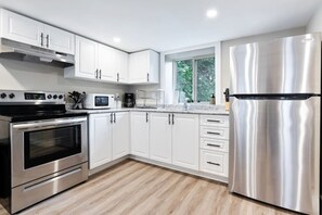 The kitchen invites you to experiment with new recipes, offering a stylish and practical space to cook and create.