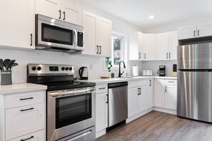 The kitchen invites you to experiment with new recipes, offering a stylish and practical space to cook and create.