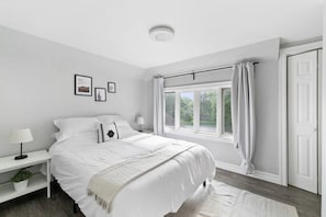 You’ll feel enveloped in warmth in this charming room with its rich wood accents and inviting bed. Wake up refreshed, surrounded by rustic coziness, and enjoy the perfect mix of comfort and natural vibes