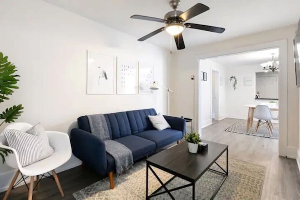 Spacious living room with stylish decor, perfect for unwinding after a day of exploring the local area.