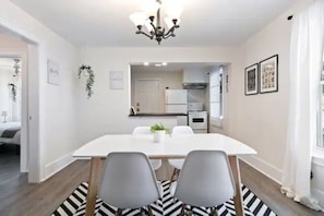 The spacious dining room invites you to savor every moment, whether enjoying a quiet meal or hosting a festive gathering.