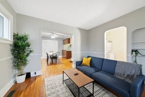 As you take a seat in the living room, the comfortable furniture and tasteful design make it easy to unwind.