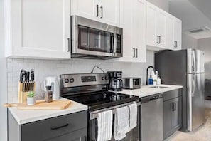 As you step into the kitchen, the clean lines and functional design make you eager to start cooking your favorite dishes.
