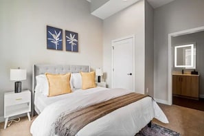 The bedroom’s serene ambiance invites you to relax, with a plush bed that promises a restful night's sleep.