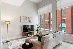 Relax in the living room and watch your favorite shows, lounging is a great way to unwind after a long day.