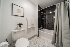 You feel a sense of calm as you enter the bathroom, where the thoughtful design and high-quality materials create a serene environment.