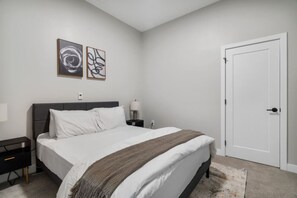 The bedroom’s serene ambiance invites you to relax, with a plush bed that promises a restful night's sleep.
