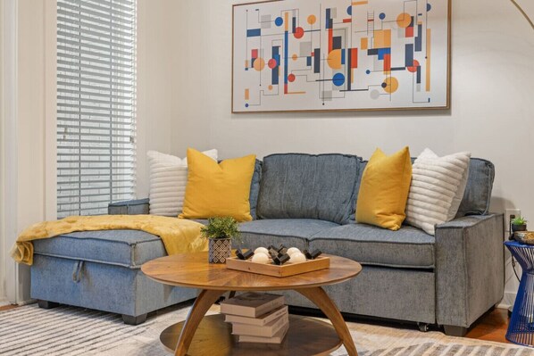 Once you enter the living room you'll find a space that feels both luxurious and cozy, perfect for unwinding after a long day.