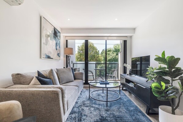  Kick back in the living room creating movie nights at home. Both air-conditioning and heating keeps things comfortable.
