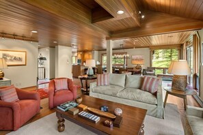 The living room with ample seating is located off the kitchen and dining area.