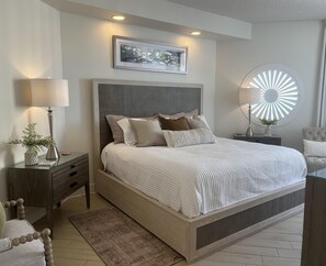 The gorgeous master bedroom has new furniture and amazing views!