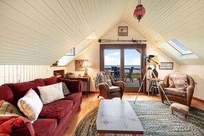 Apartment living space with comfortable seating and views.
