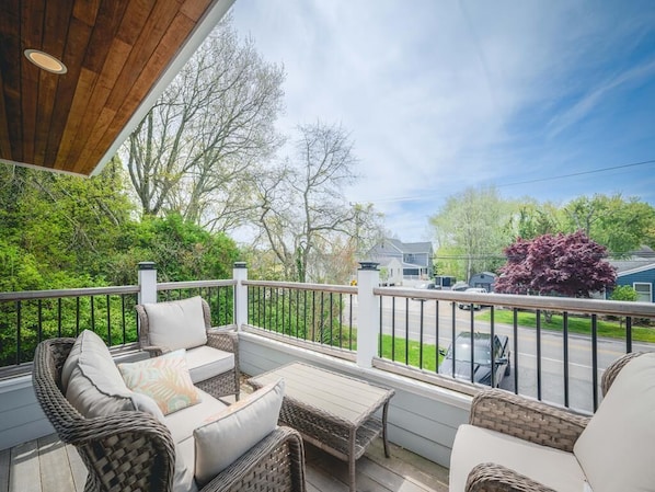 Another angle of the scenic deck with comfortable outdoor furniture for relaxation.