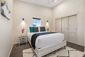 Furnished bedroom with plush bedding