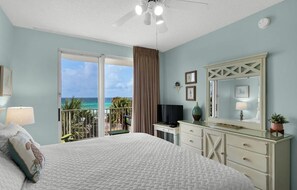 Big Gulf views from the primary bedroom which features a King Bed, Smart TV, large closet, and private bathroom with dual vanity + new walk in shower!