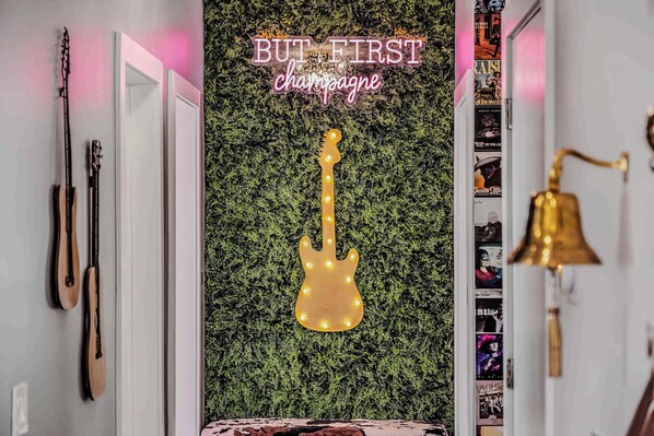 Experience Nashville in this chic vacation rental! With a guitar accent and But First Champagne sign, it's perfect for bachelorette parties or family reunions. Enjoy music vibes and upscale comfort in this luxurious haven.