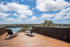 The rooftop deck with sun loungers offers one of the most prime viewing spots in The Sands Estate.