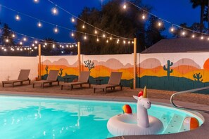Twinkling string lights create a magical atmosphere, transforming the space into a cozy, inviting retreat.