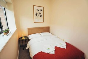 Relax and recharge in this stylishly designed bedroom