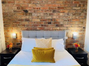 Relax and unwind in a comfortable double bedroom, designed for a restful stay