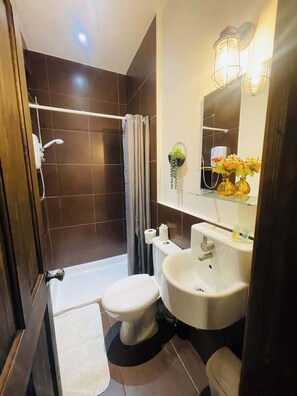 A pristine and stylish bathroom designed for your relaxation and convenience